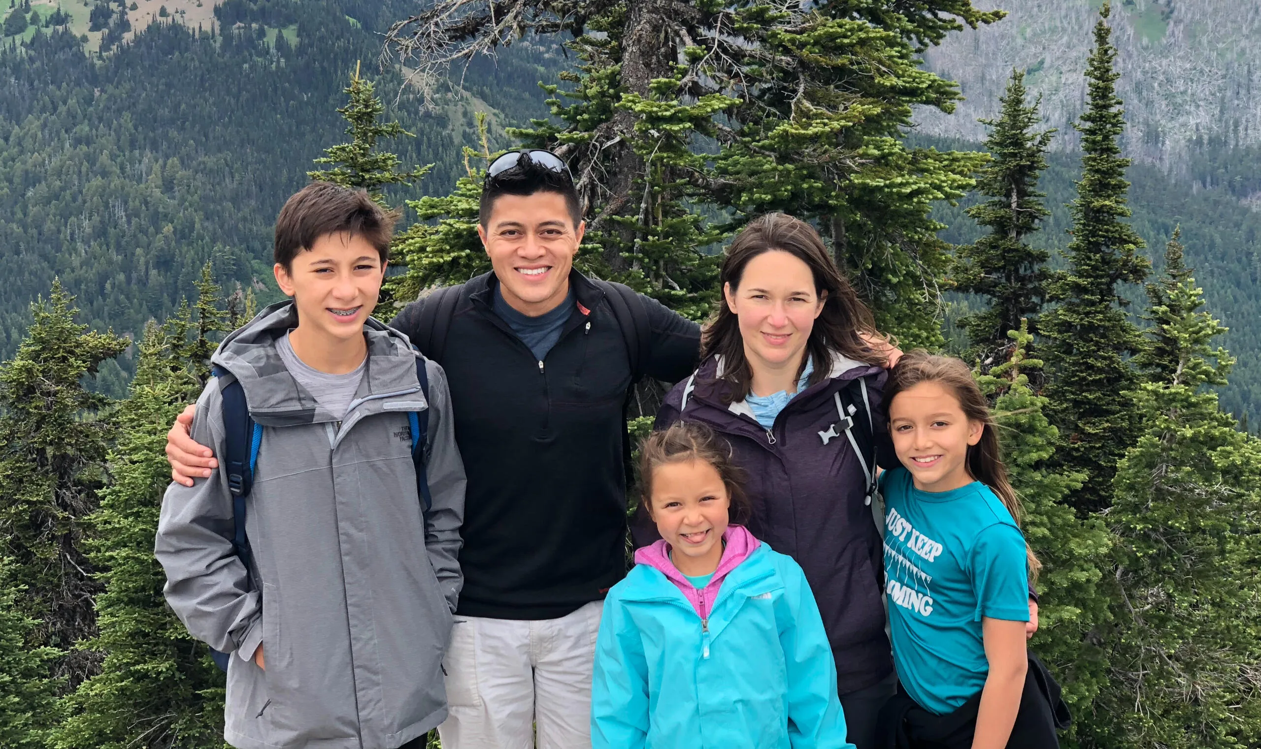 Amber Concepcion hiking with her family in the mountains